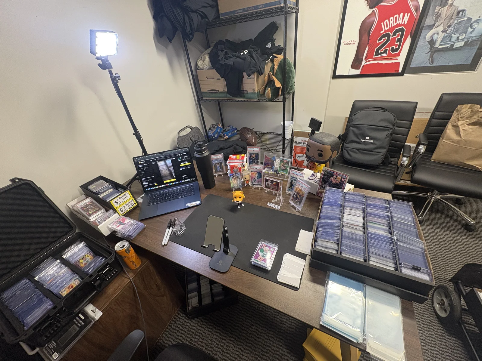 Sports Card Hustle live streaming workspace with laptop, ring light, and graded cards ready for auction
